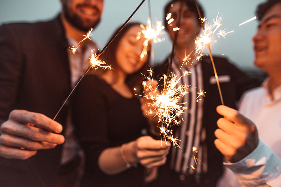 People Holding Sparklers