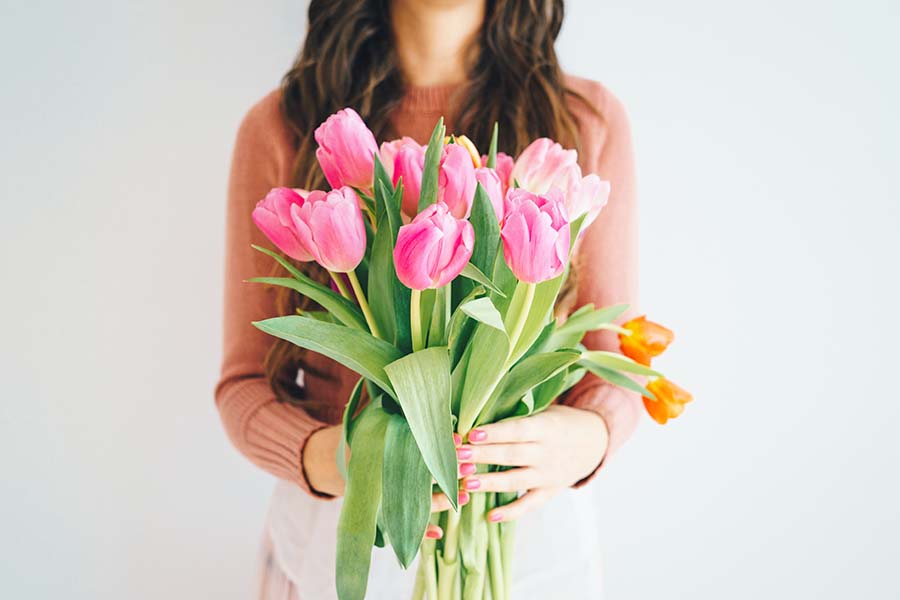 woman holding tulips